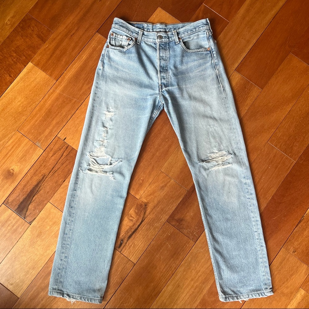 Levi’s 501 light wash blue distressed 90s straight leg jeans